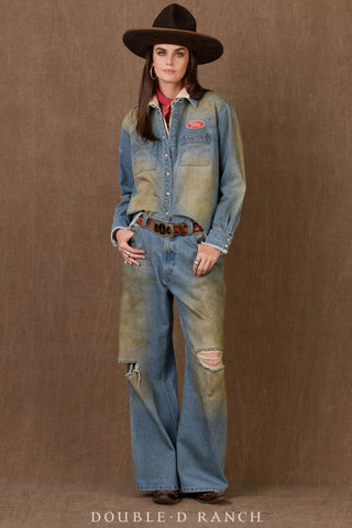 Distressed light wash denim workshirt with vintage patch, worn over red collar, paired with matching wide-leg jeans.