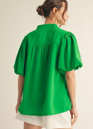 Short puff sleeves mock neck top, shirring detail, v neckline.