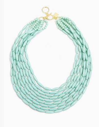 Multi-strand mint green glossy oval beaded statement necklace with gold toggle clasp closure.