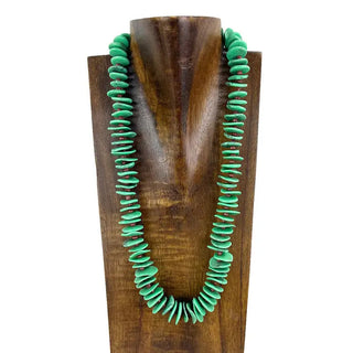 23-inch light green flat stone beaded necklace displayed on a wooden bust against white background.