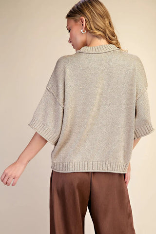 Beige lurex metallic knit sweater with short dolman sleeves, ribbed cuffs, and collar, back view.