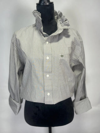 Gray and white pinstripe cropped button-up shirt with ruffled collar and folded cuffs displayed on mannequin.