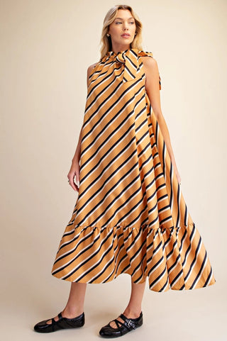Mustard yellow diagonal striped sleeveless midi dress with ruffle hem and tie neck detail.