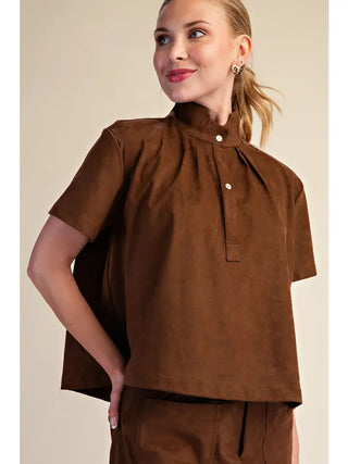 Brown suede-look stand collar short sleeve pullover shirt with gold button placket detail.