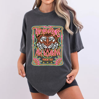Dark gray Comfort Colors oversized tee featuring a roaring tiger graphic with pink neon text reading "The Heavens Are Roaring