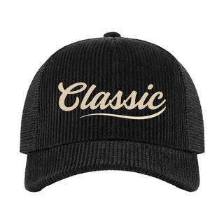 Black corduroy trucker hat with cream script "Classic" embroidery and decorative swoosh underline.