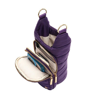 Deep amethyst purple quilted crossbody HydroBag with gold zippers, open compartments, and interior organization pockets.