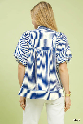 Blue and white striped puff sleeve babydoll top with gathered back yoke, shown from behind.