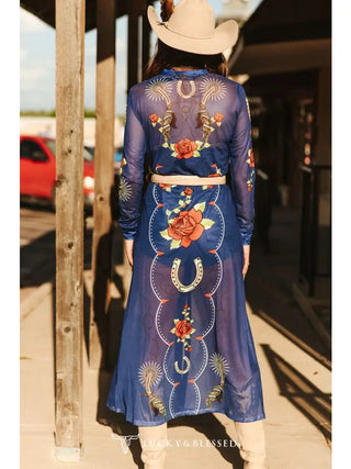 Denim blue sheer mesh maxi duster with red roses, horseshoes, and Western spur print details.