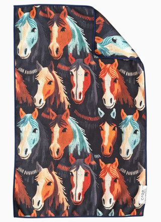 Colorful horse-print double-sided hand towel featuring illustrated equine faces on dark navy background.